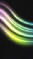 Colorful abstract light waves on black background creating a flowing dynamic pattern photo