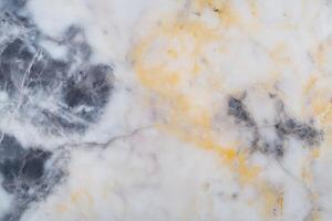 Elegant marble texture with yellow and black veins photo