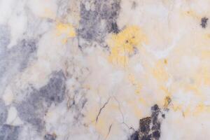 Abstract marble texture with grey and yellow patterns photo