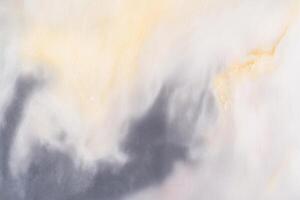 Abstract soft cloudy texture with hints of warm yellow and cool gray tones photo