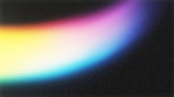 Colorful light leak creating a spectrum gradient on dark background photo