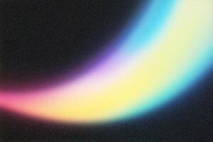 Colorful light streak creating gradient effect on dark background photo