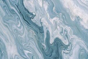 Abstract marbled texture in blue and white tones with swirling patterns photo