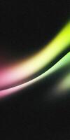 Colorful abstract wave with vibrant gradient on black background photo
