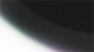 Light leak creating gradient on black grainy background photo