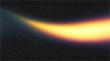 Light streak creating a warm glow on dark background photo
