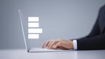 Hands of a business professional typing on a sleek laptop, with a blurred background showcasing digital interface elements and a modern workspace atmosphere photo