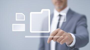 Businessman in a suit interacting with digital interface, selecting file icons and folders, showcasing modern technology and digital organization concepts in a professional environment photo
