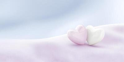 Two glossy heart-shaped objects, one pink and one white, resting on a soft pastel fabric, creating a romantic and serene atmosphere for love-themed designs and decorations photo