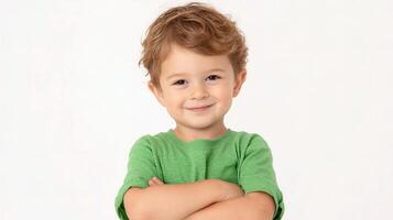 A young boy with his arms crossed in front of him photo
