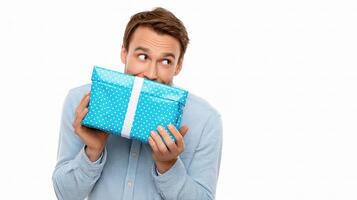 A man holding a blue gift box photo