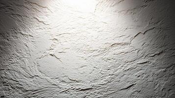 A wall with a light shining on it photo