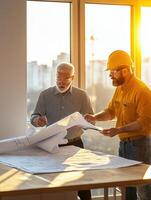 Tungsten Light Illuminating Engineers Analyzing Blueprints photo