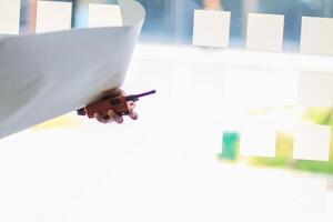 A person holding a piece of paper with a piece of paper on it photo