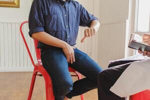 Man sitting on chair photo