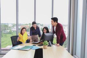 Team Collaboration in Modern Office Meeting, Business Asian Business Team Meeting in Office, Startup Team Planning Project During Office Meeting photo