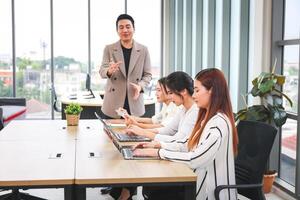 Young Startup Team Planning Project During Office Meeting, Business People Team Meeting in Office photo