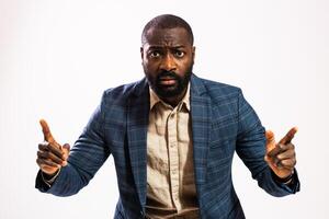 Studio shot of African American professional in business attire expressing displeasure and concern, representing themes of mobbing or toxic workplace dynamics. photo