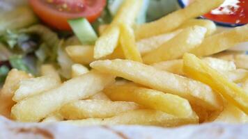 child Enjoying crispy fries with tangy dipping sauce video