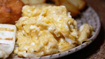 Scrambled eggs served with freshly baked bread video