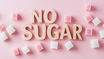 White sugar cubes pattern with wooden text in pink background flat lay view photo