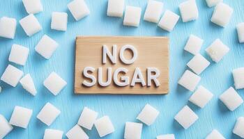 White sugar cubes pattern with text in blue background photo