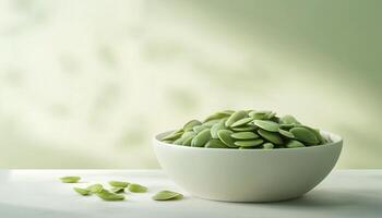 Organic green pumpkin seed on white ceramic bowl with light shadow photo