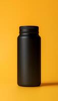 Black plastic bottle for drinking refill in daily activity in yellow background photo