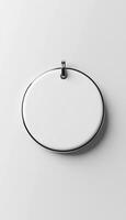 Badge blank pink silver frame mockup on grey vertical wall background photo