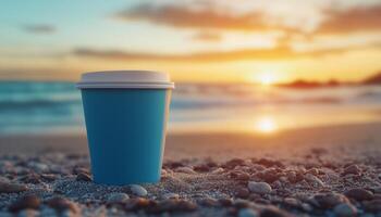 Coffee paper cup mockup blue matte color on beach with sunset sky and shell decoration photo