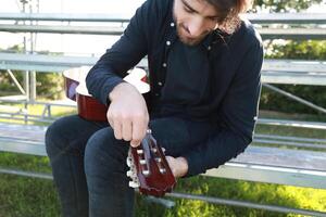 Hand Turns Wrench For Manual Tuning Of Classical Guitar Outdoor photo