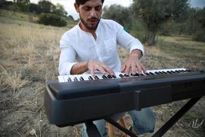 Smile Man Play The Musical Keyboard Crossing In Rhythm In The Nature Outdoor photo