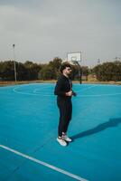 Basketball Player Jogs in Place to Get Ready for the Game photo