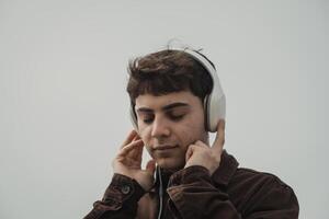 Man Feeling Free While Listening To Music On The Shore During Winter outdoor photo