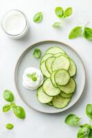 Crispy zucchini fritters served on vintage plate with sour cream for a delightful culinary experience photo