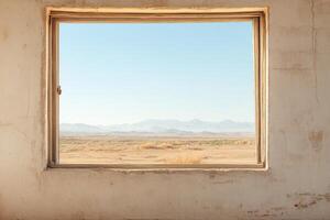 Old window framing a breathtaking view of a desolate landscape revealing natures quiet beauty and the passage of time photo