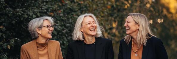 Friends enjoy laughter and connection while embracing life in their forties in a natural setting photo