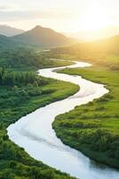 Expansive view of a winding river system flowing through lush landscapes with people enjoying nature at sunset photo
