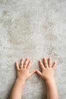Childs hands pushing against an invisible barrier, expressing the need for boundaries and personal space in a playful moment photo