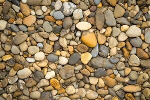 High quality studio background showcasing a pebbled beach with realistic lighting and soft focus for creative projects photo