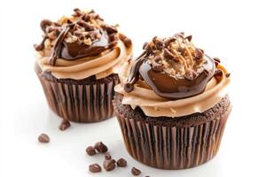 Delicious chocolate cupcakes topped with creamy frosting and crunchy nuts on a white background photo