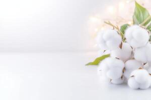 Playful arrangement of soft white cotton balls on a minimalist backdrop creating a light and airy feel photo