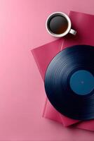 Stylish vinyl record and coffee cup on colorful background with ample space for text photo