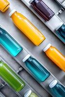 Vibrant juice production facility showcasing an array of colorful bottled juices ready for distribution photo