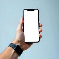 A person holding a smartphone with a blank screen photo