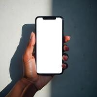 A person holding up a white blank screen on a phone photo