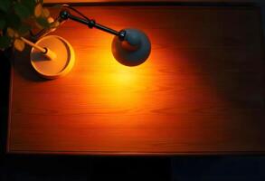 A lamp on a table next to a wooden table photo