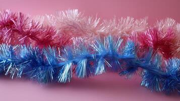 A close up of some blue and pink tinsel. photo
