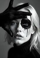 A woman with black makeup and a black eye photo