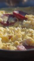 Enjoying a sunny morning with scrambled eggs and sausage video